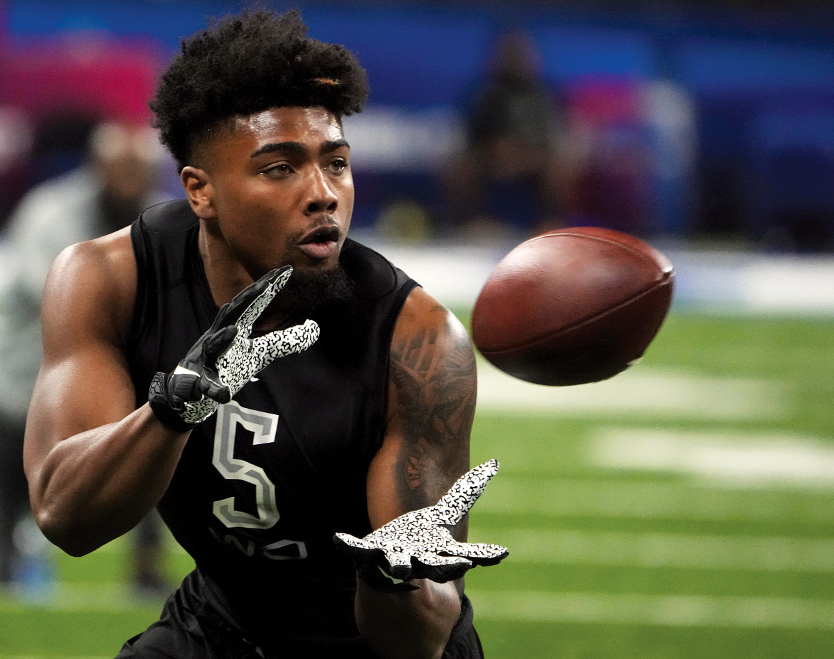 p.p1 {margin: 0.0px 0.0px 0.0px 0.0px; font: 13.0px 'Helvetica Neue'}    rkansas wide receiver Treylon Burks (WO05) goes through drills during the 2022 NFL Scouting Combine at Lucas Oil Stadium.